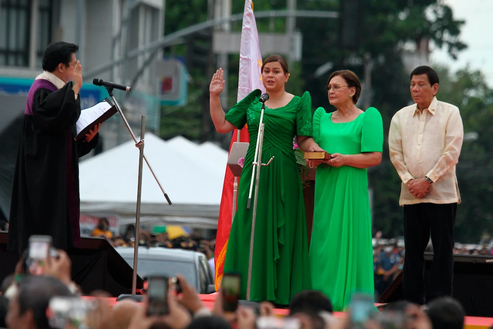 Sara Duterte, the daughter of outgoing president of the Philippines, takes her oath as vice president during rites in her hometown in Davao city, southern Philippines on June 19, 2022. (AP)