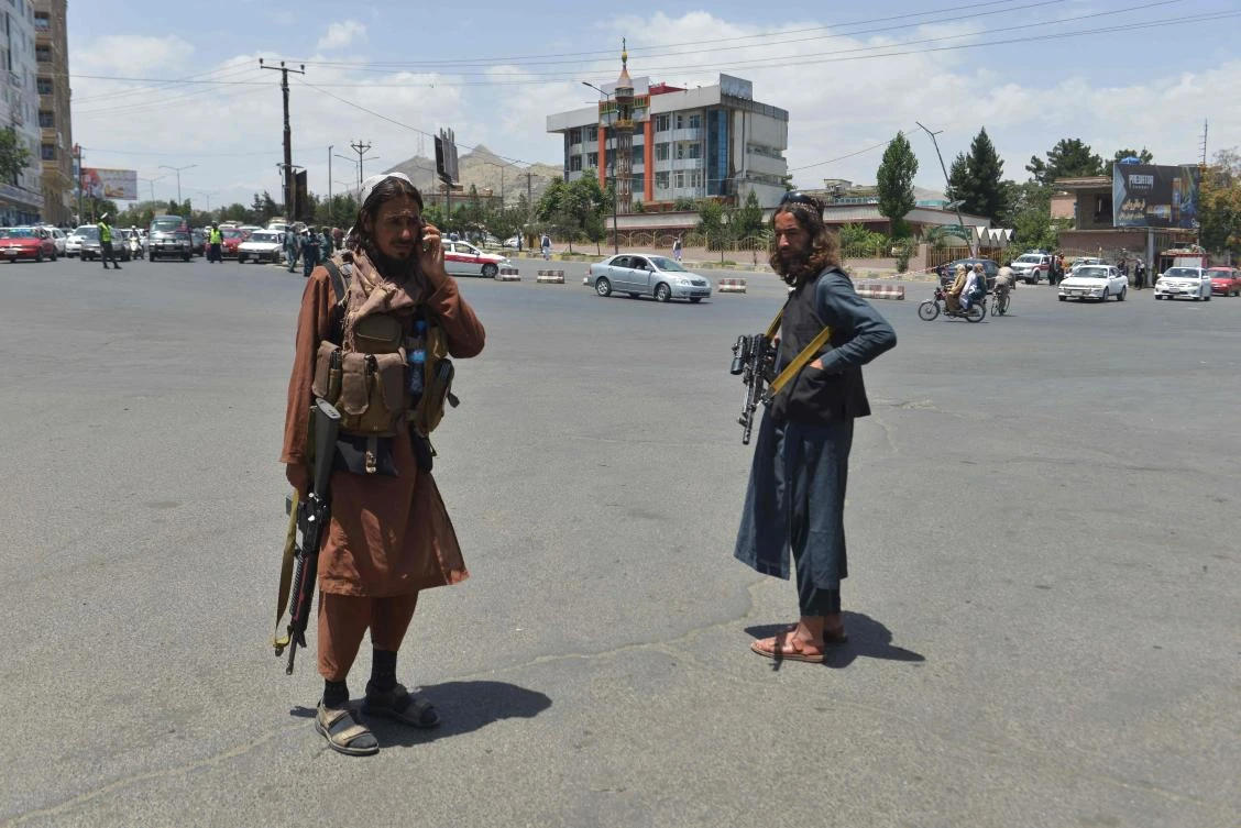 Taliban fighter stands guard along a road in Kabul on June 18, 2022. (AFP)
