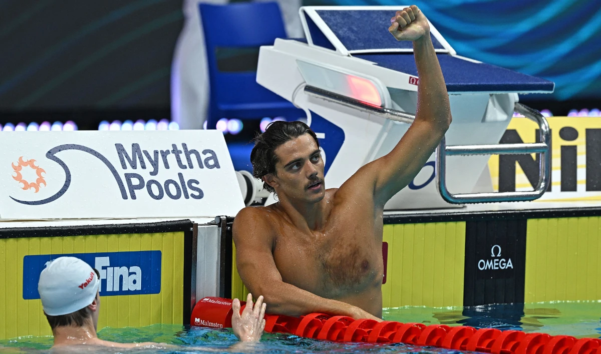Italy's Thomas Ceccon celebrates taking gold and setting a new world record in the men's 100m backstroke finals at the Budapest 2022 World Aquatics Championships on June 20, 2022. (AFP)