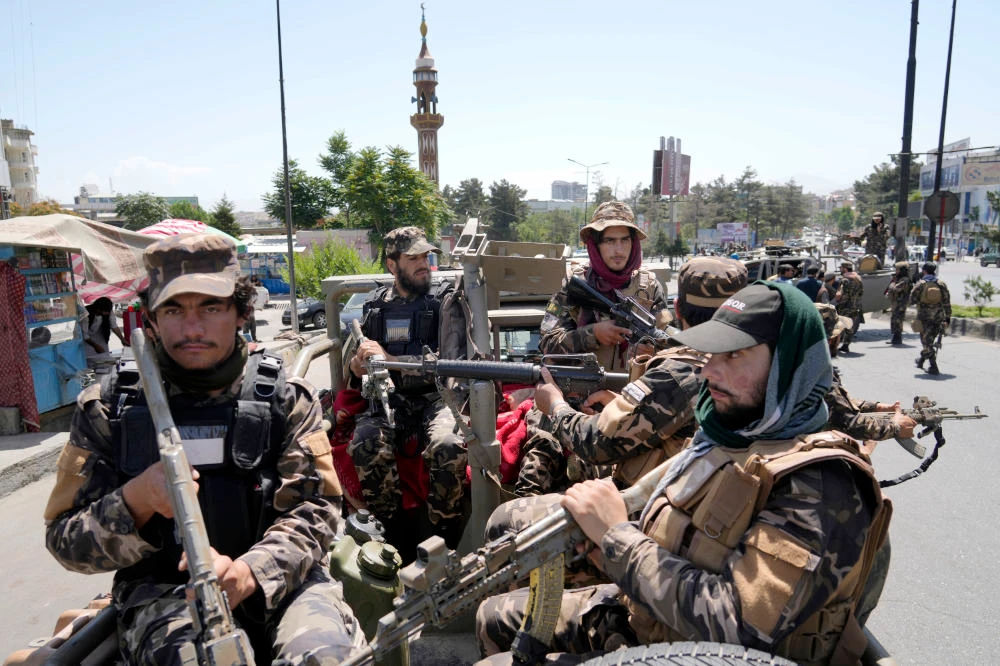 Taliban fighters guard at the site of an explosion in Kabul, Afghanistan, Saturday, June 18, 2022. (AP)