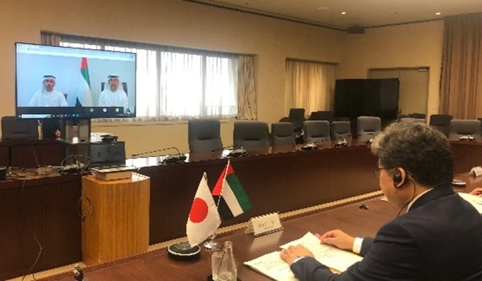 Minister Hagiuda Koichi holds a video conference with UAE’s Minister of Energy and Infrastructure Suhail Mohamed Al Mazrouei. (METI)