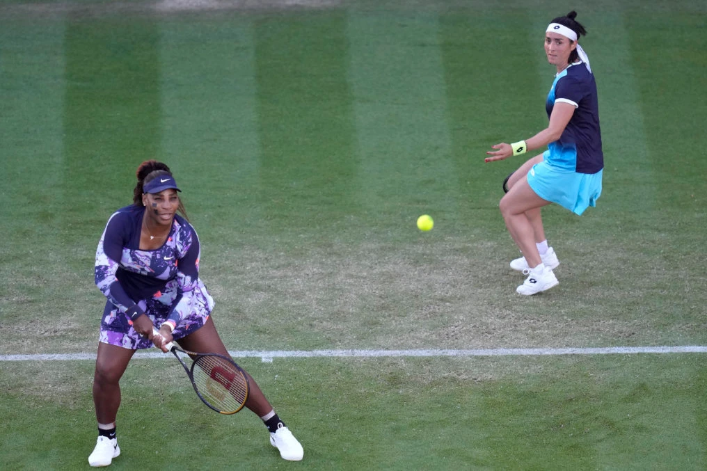 Serena Williams of the United States and Ons Jabeur of Tunisia return a ball to Shuko Aoyama of Japan and Hao-Ching of Taiwan during their quarterfinal doubles match at the Eastbourne International tennis tournament in Eastbourne, England, Wednesday. (AP)