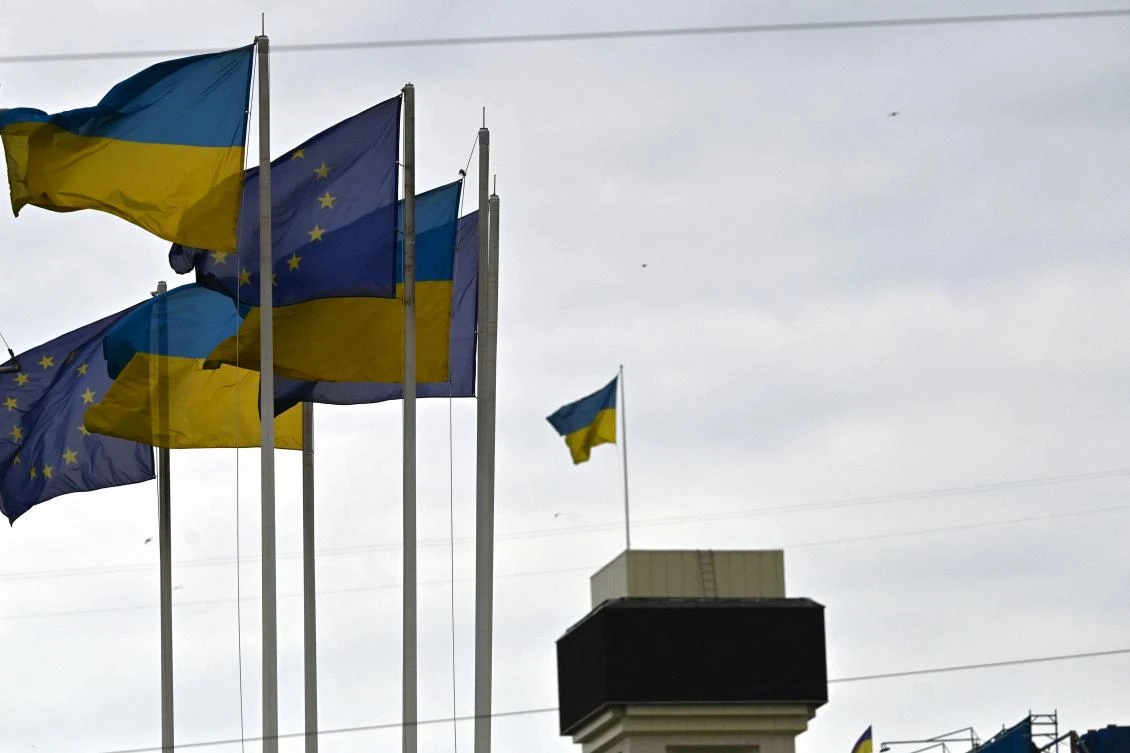 Flags of Ukraine and European Union wave at European Square in Kyiv on Friday. (AFP)