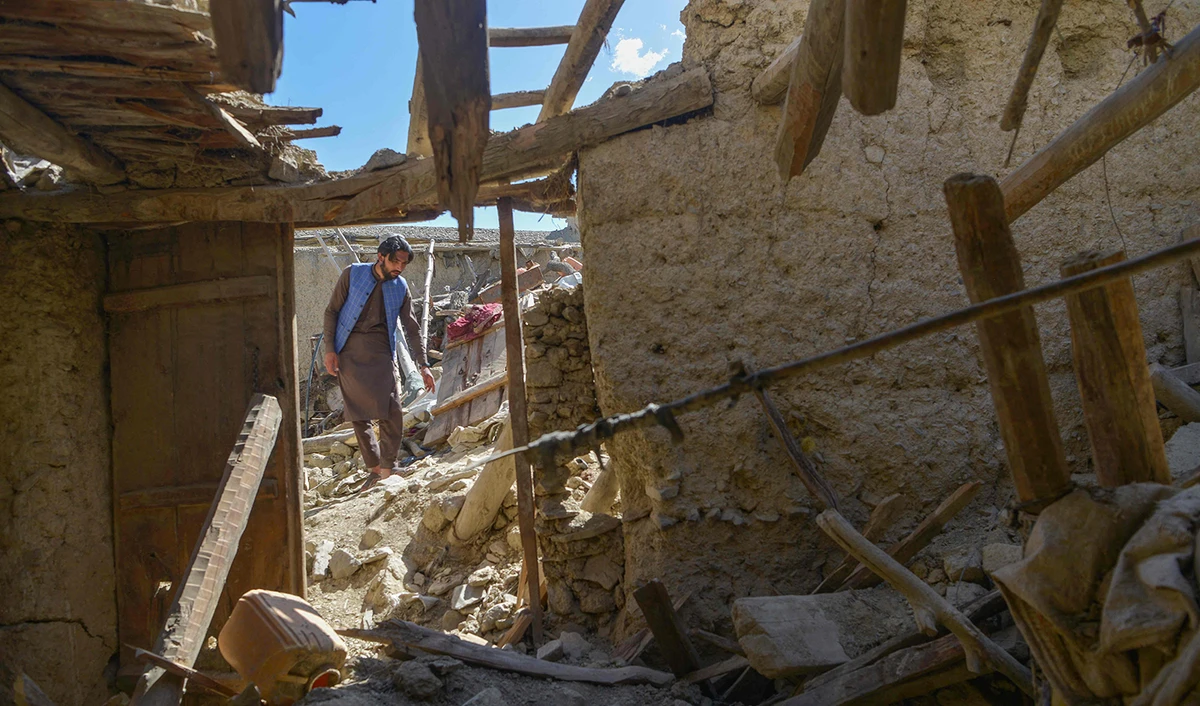 A man looks for his belongings amid the ruins of damaged houses after an earthquake in Gayan district in Afghanistan's Paktika province on June 24, 2022. (AFP/File)