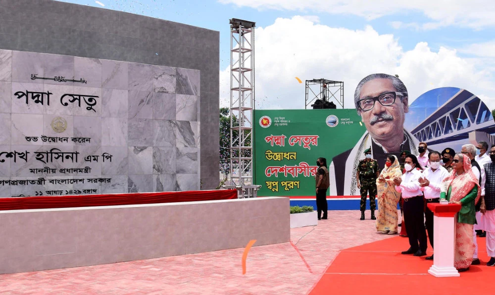 In this handout photo released by Bangladesh Prime Minister's Office and taken on June 25, 2022 shows Bangladesh's Prime Minister Sheikh Hasina (4R) inaugurating the 6.15km long Padma Bridge at Mawa point in Munshiganj. (AFP)