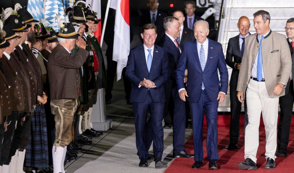 US President Joe Biden, center right, after his arrival at Franz-Josef-Strauss Airport near Munich, Germany, Saturday, June 25, 2022, ahead of the G7 summit. (AP)