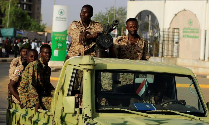 Sudanese soldiers are seen on an army vehicle as they drive through the defense ministry compound in Khartoum, Sudan, May 2, 2019. (Reuters)