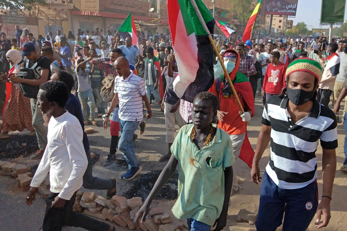 The protests come on the anniversary of a previous coup in 1989, which toppled the country’s last elected civilian government and ushered in three decades of iron-fisted rule by general Omar Al-Bashir. (File/AFP)