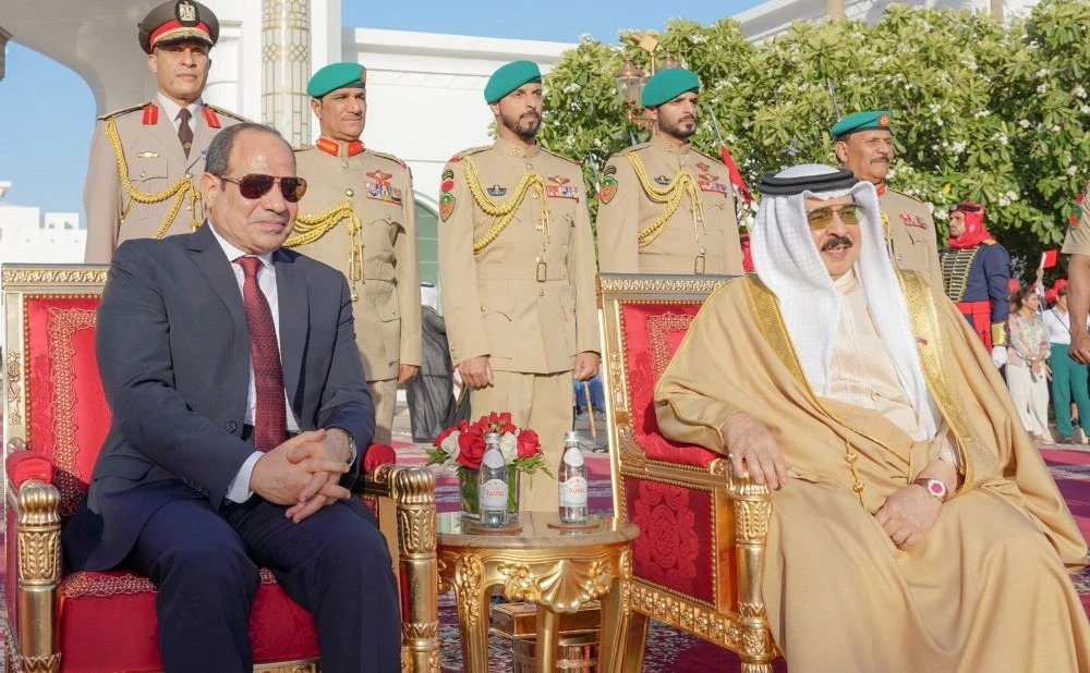 Bahrain’s King Hamad bin Isa Al Khalifa receives Egyptian President Abdel Fattah El-Sisi upon his arrival at Sakhir Air Base in Sakhir, Bahrain, June 28, 2022. (Reuters)