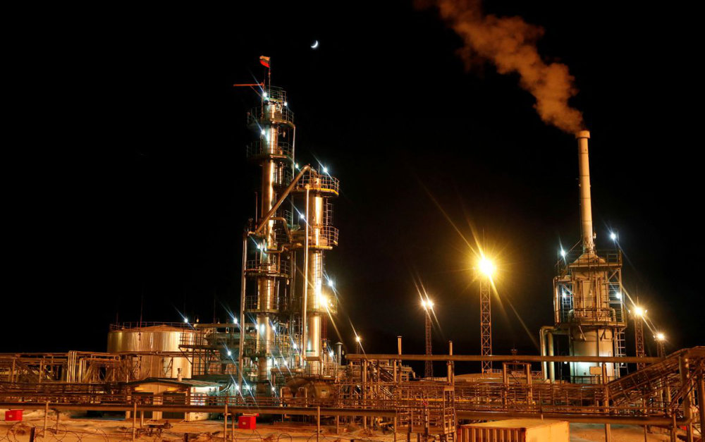 A Russian state flag flies on the top of a diesel plant in the Yarakta Oil Field in Irkutsk Region, Russia. (Reuters)
