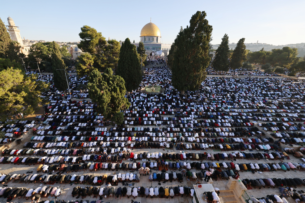 Palestinian Muslims peform the Eid al-Adha morning prayer at the Al-Aqsa mosques compound in Jerusalem. (AFP)