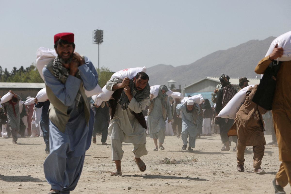 Kabul resident on at a distribution centre in Kabul, Afghanistan, April 7, 2022. (REUTERS)