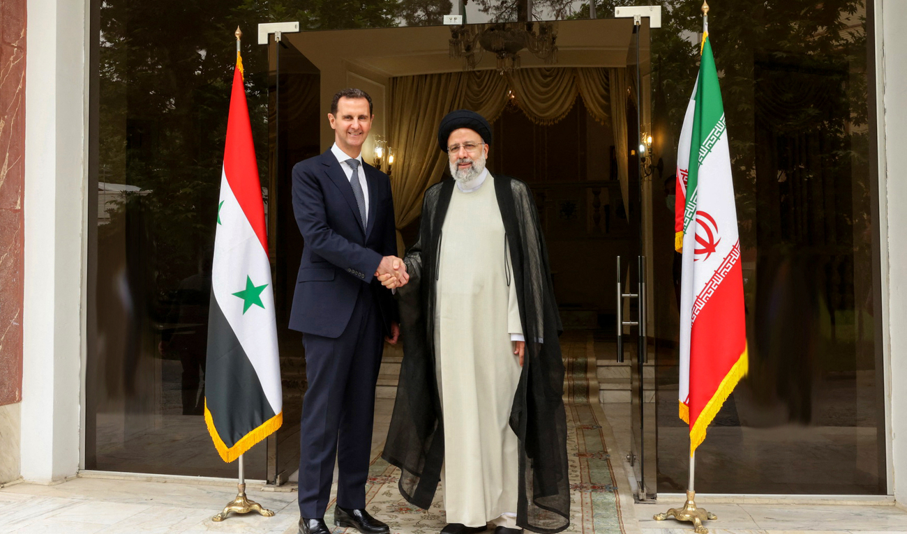 Iranian President Ebrahim Raisi (R) receives Syrian President Bashar Assad in Tehran on May 08, 2022. (AFP/File)