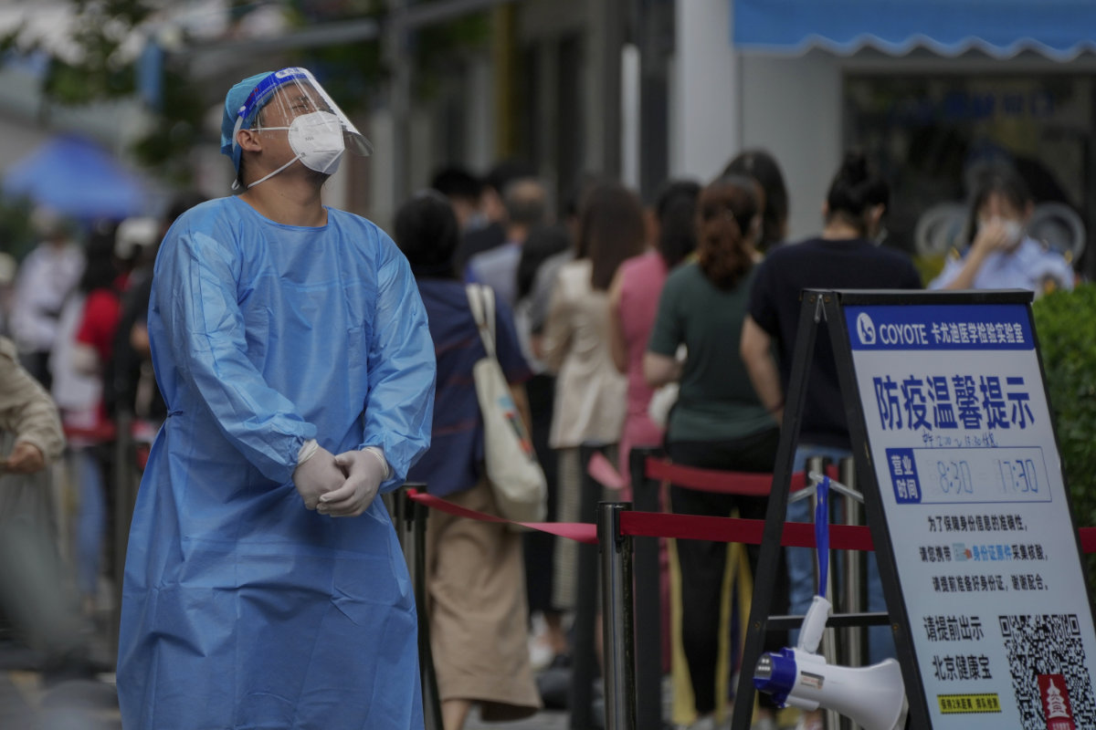 Residents line up at a COVID-19 testing center in Beijing on July 4, 2022. (AP)