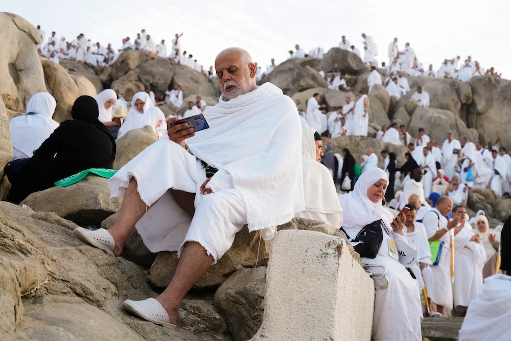 Muslim pilgrims pray on the rocky hill of Mount Arafat. (AP)