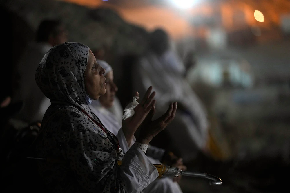 A pilgrim pray on the rocky hill of Mount Arafat. (AP)