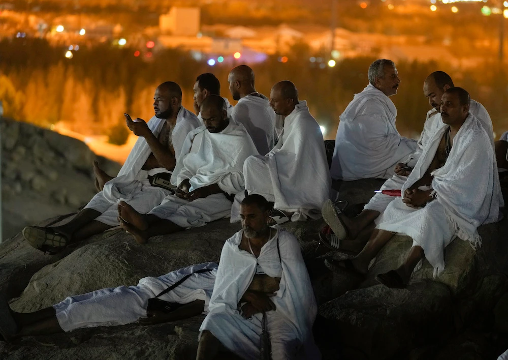 Muslim pilgrims pray on the rocky hill of Mount Arafat. (AP)