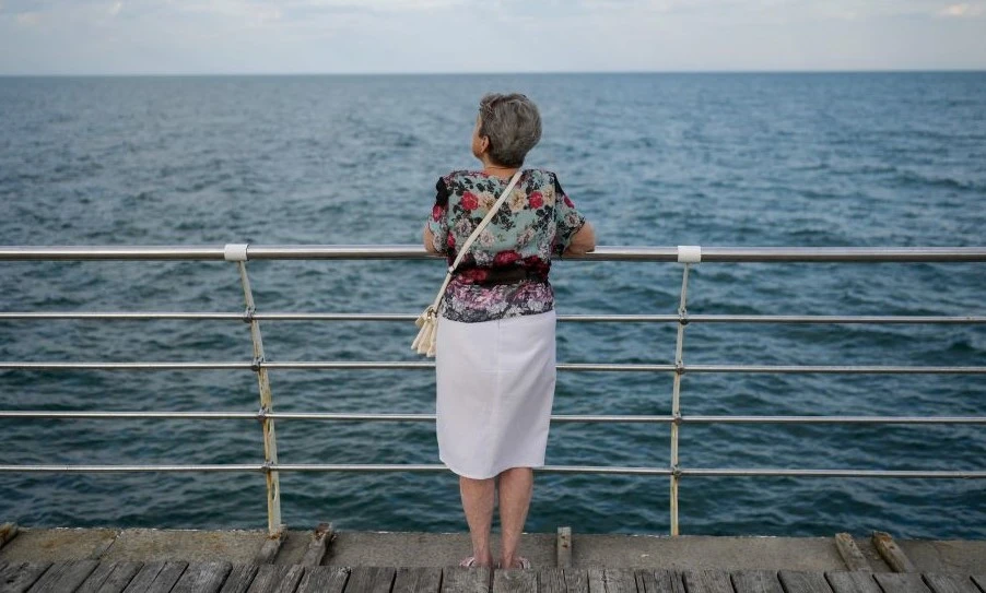 A woman looks out at the Black Sea, near Odessa, amid the Russian invasion of Ukraine, July 20, 2022. (AFP)