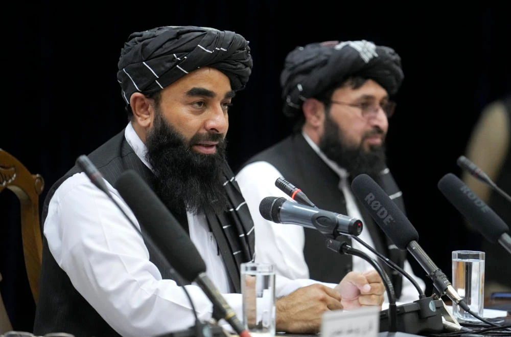 Zabiullah Mujahid, left, the spokesman for the Taliban government, speaks during a press conference in Kabul, Afghanistan, Thursday, June 30, 2022. (AP)