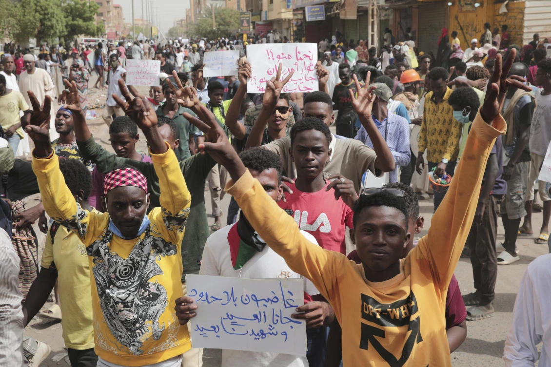 Anti-military protesters march on Friday in Khartoum, Sudan, a day after nine people were killed in demonstrations against the country’s ruling generals. (AP)