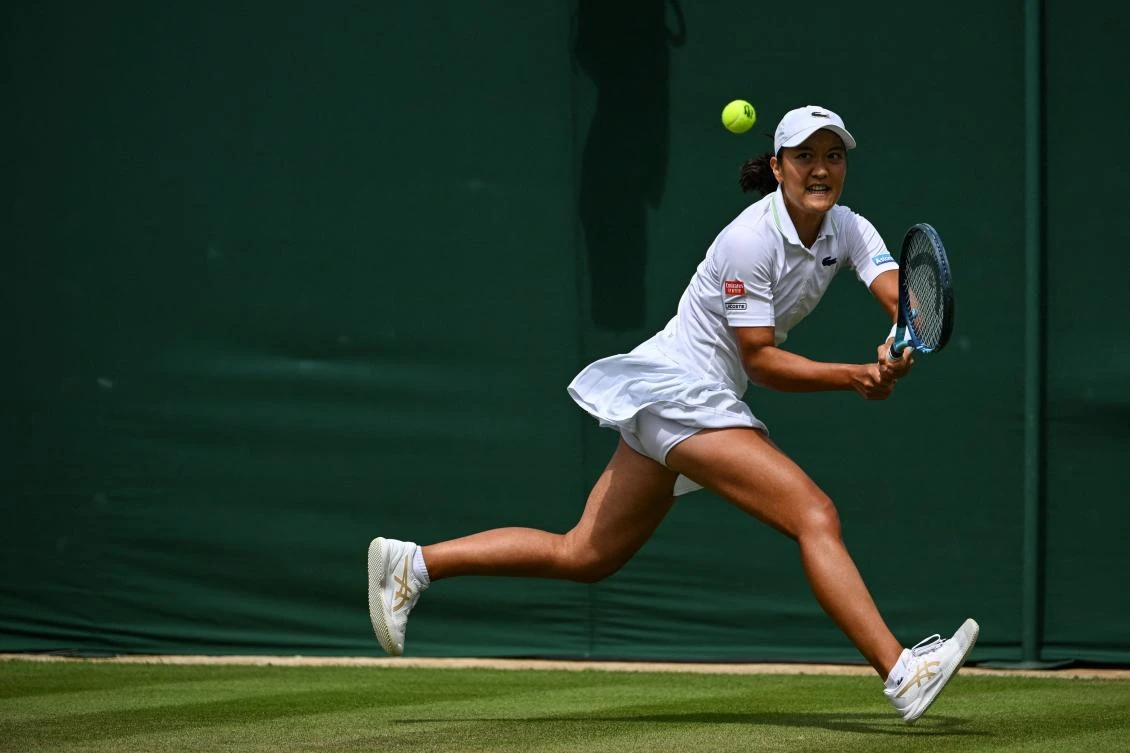 France’s Harmony Tan returns the ball to Britain’s Katie Boulter during their women’s singles tennis match on the sixth day of the 2022 Wimbledon Championships at The All England Tennis Club in Wimbledon on Saturday. (AFP)