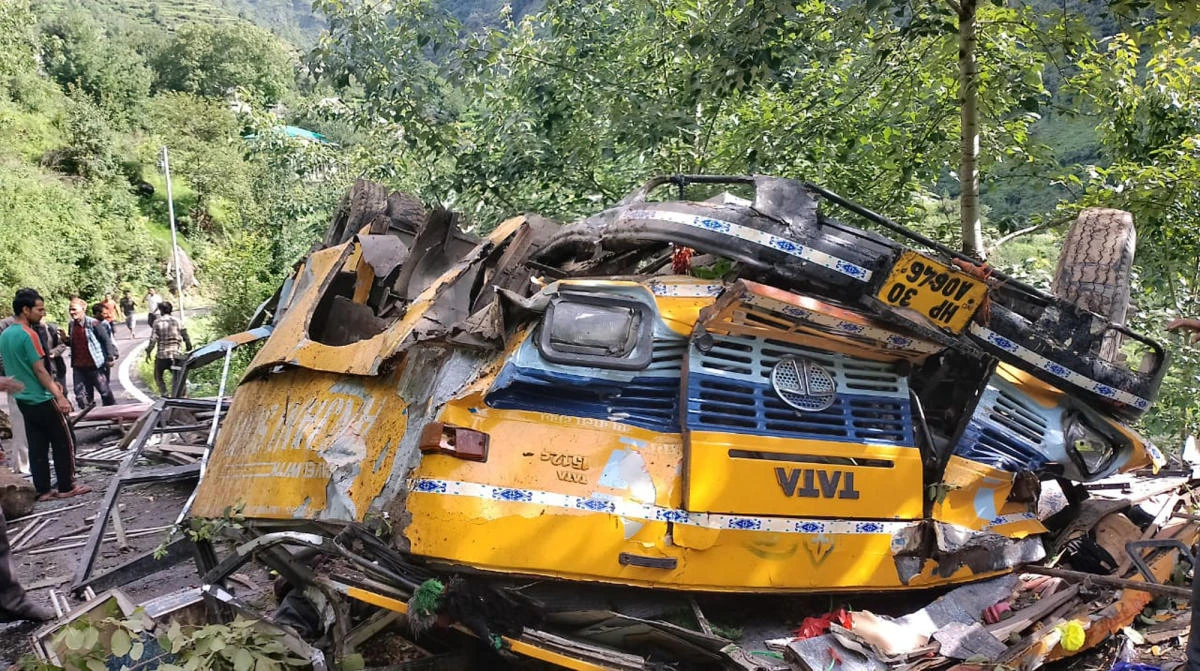 Above, the wreckage of a passenger that bus slid off a mountain road and fell into a deep gorge near Kullu, Himachal Pradesh state on July 4, 2022. (Deputy Commissioner’s office, Kullu via AP)