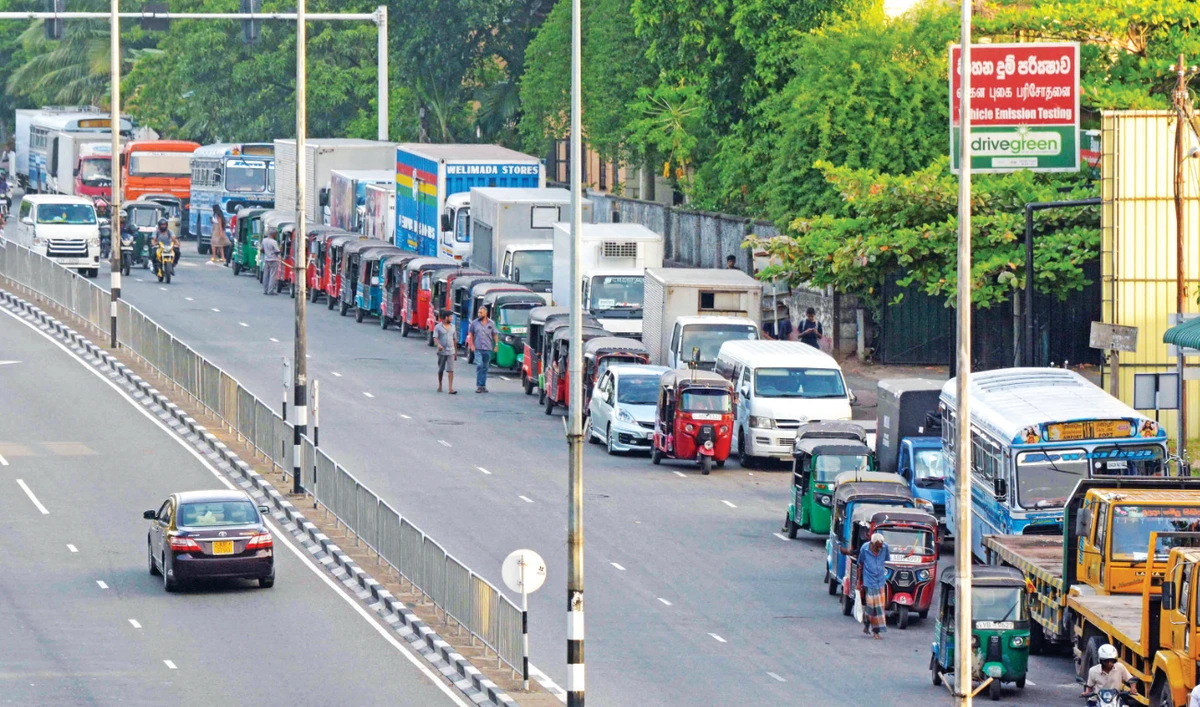 Long queues of drivers have been sighted across Colombo at gas stations, as some wait for more than 48 hours to fill their vehicles. (AFP)