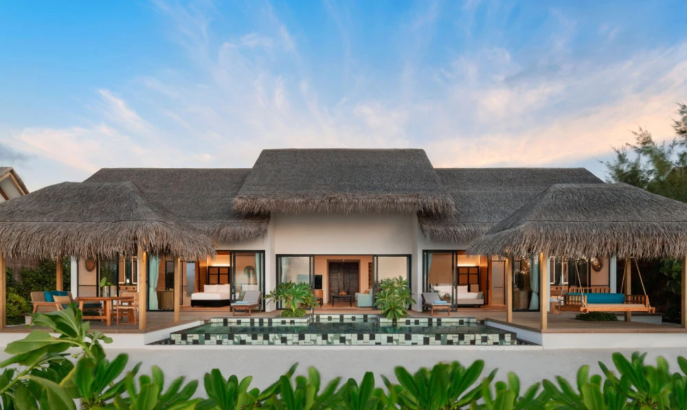 The resort features 109 expansive beach and overwater villas, each offering a private pool and enticing views of the surrounding turquoise lagoon.