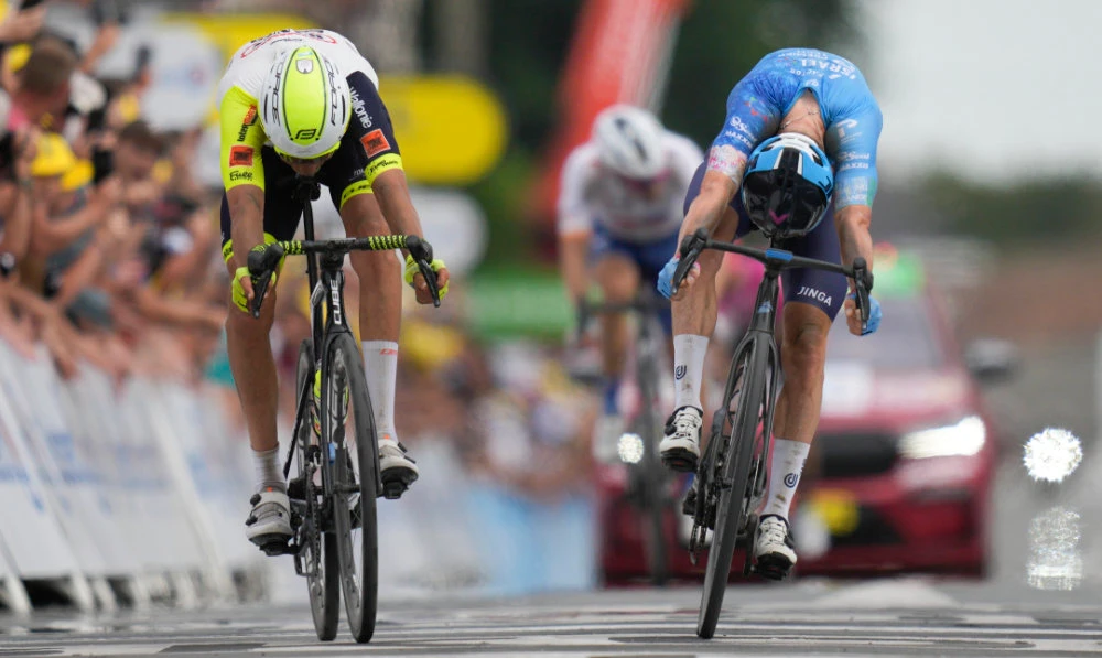 Cobble king Clarke rules Tour de France stage five with bike throw