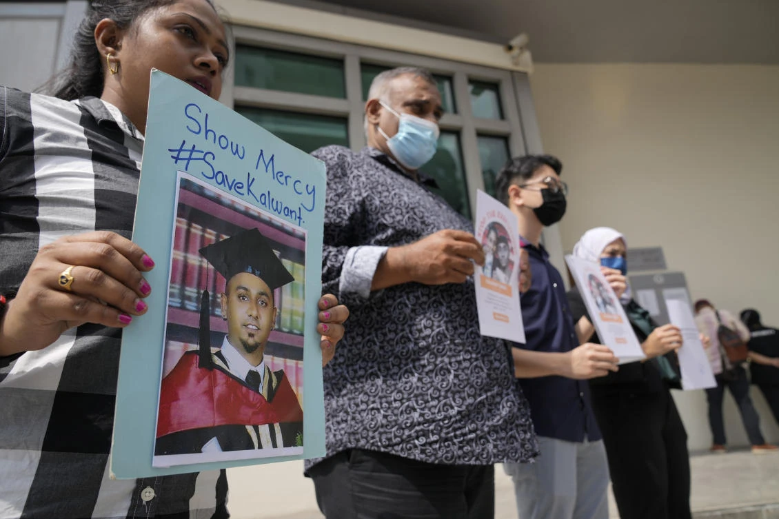 Anti-death penalty activists call for a stay in the execution of a Malaysian convicted for drug trafficking in Singapore on July 4, 2022. (AP)