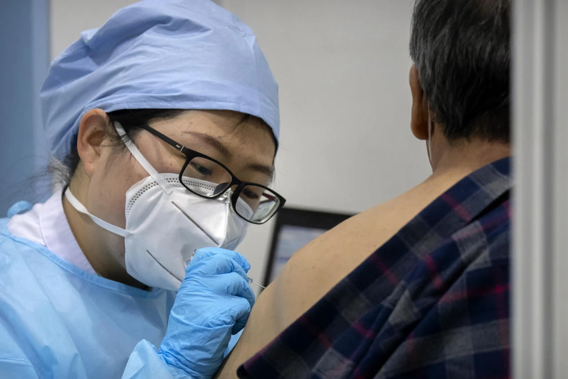 The Beijing government is concerned about the remaining numbers of unvaccinated people, especially those over age 60 who are vulnerable. (AP)