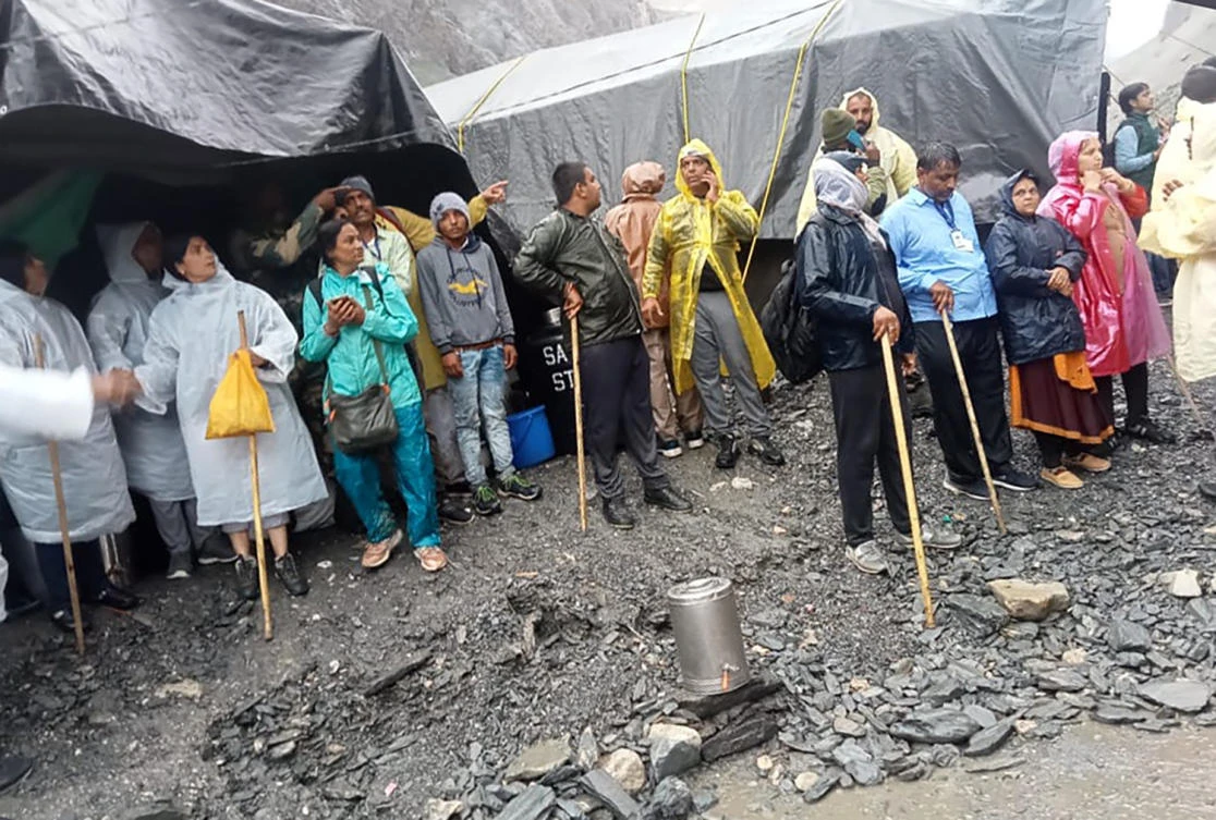 Hindu devotees are seen stranded after a cloudburst near the base camp of the holy cave shrine of Amarnath in south of Kashmir Himalayas, in India, on Friday. (AP)