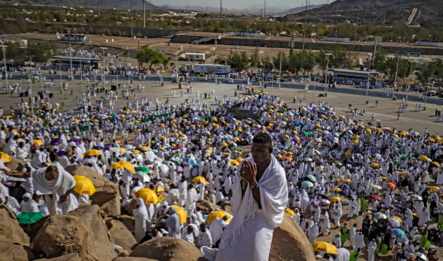 A Muslim pilgrim prays atop Mount Arafat, also known as Jabal al-Rahma (Mount of Mercy), southeast of the holy city of Makkah, during the climax of the Hajj pilgrimage, on July 8, 2022. (AFP)