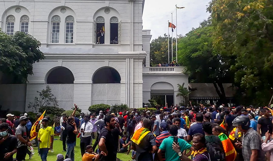 Protestors gather inside the compound of Sri Lanka's Presidential Palace in Colombo on July 9, 2022. (AFP)