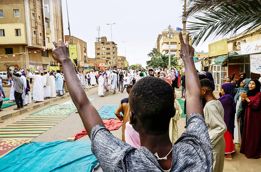 Sudanese protesters take part in a sit-in against military leader Gen. Abdel Fattah Al-Burhan and his October coup on Eid Al-Adha holiday in Khartoum. (AFP)