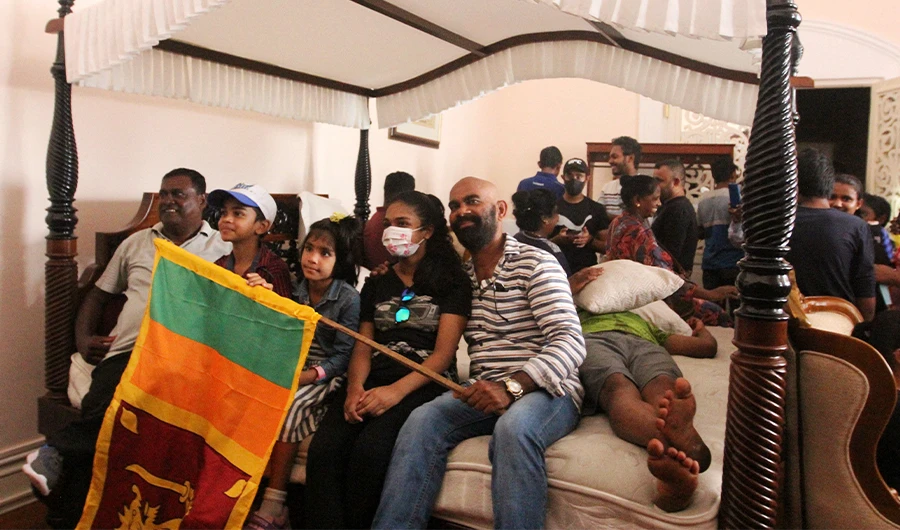 People crowd inside the official residence of Sri Lanka's President, in Colombo on July 10, 2022. (AFP)