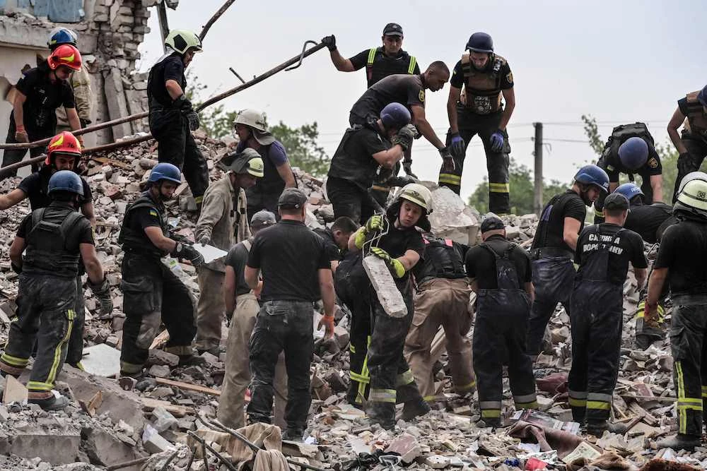 A rocket strike on a five-story apartment building in the eastern town of Chasiv Yar on Saturday night killed 15 people and left two dozen people feared trapped in the rubble. (AFP)