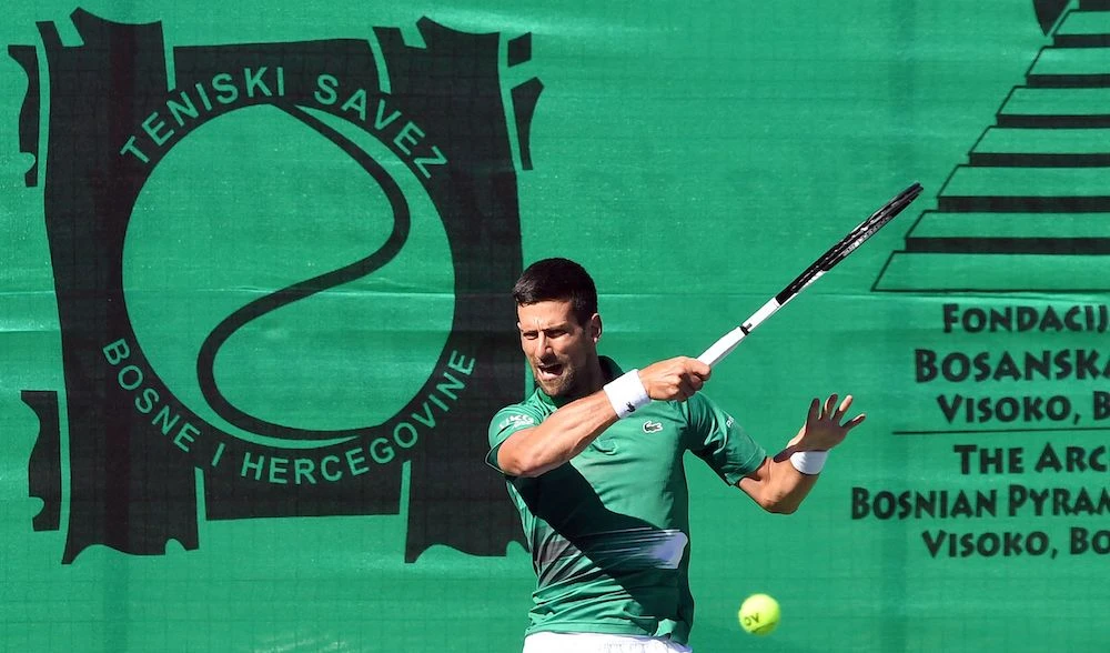 Novak Djokovic during an exhibition match to mark the opening of a tennis court at the ‘Archaeological park of the Bosnian pyramid’ near Visoko, north of Sarajevo, on July 13, 2022. (AFP)