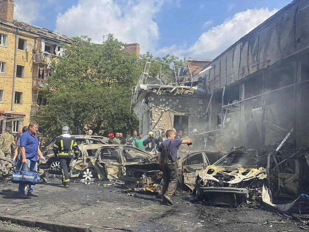 Rescuers work on a scene of damaged by shelling building in Vinnytsia, Ukraine on July 14, 2022. (Ukrainian Emergency Service via AP)