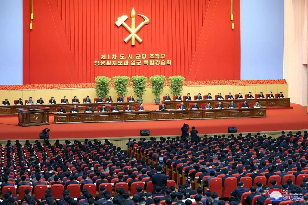 North Korean leader Kim Jong Un, center, speaks during a party meeting at the April 25 House of Culture in Pyongyang. (KCNA via KNS/AFP)