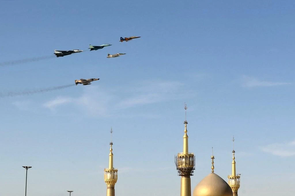 Iranian fighter jets fly over Tehran during a military parade marking the country’s annual army day on April 18, 2022. (Iranian Army/AFP)