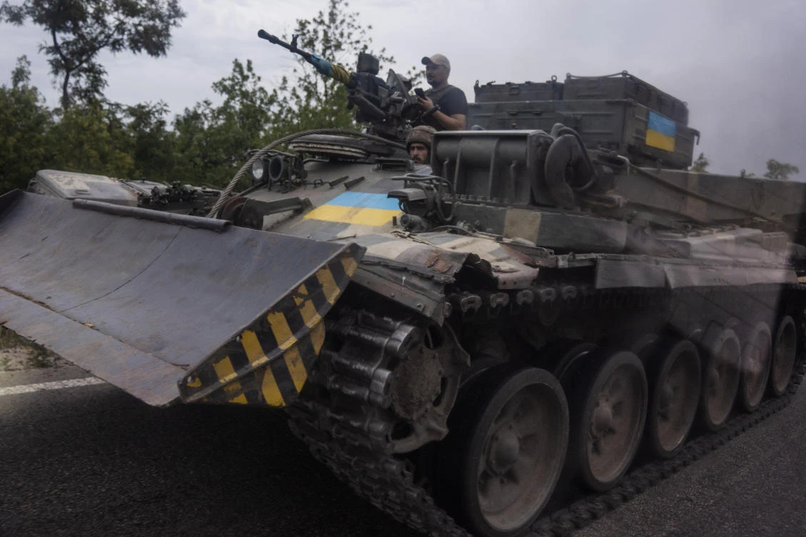 Ukrainian soldiers ride a tank on a road, in Stupochky, Donetsk region, eastern Ukraine, Sunday, July 10, 2022. (AP)