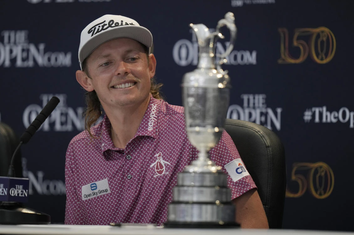 Cameron Smith, of Australia, looks at the claret jug trophy during a press conference after winning the Open Championship golf championship on the Old Course at St. Andrews, Scotland, Sunday July 17, 2022. (AP)