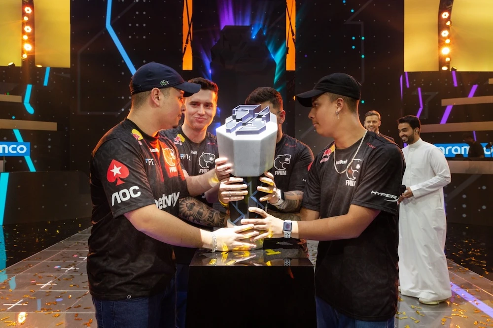 FURIA team celebrate with the trophy after winning the Rocket League final in Riyadh. (Supplied)