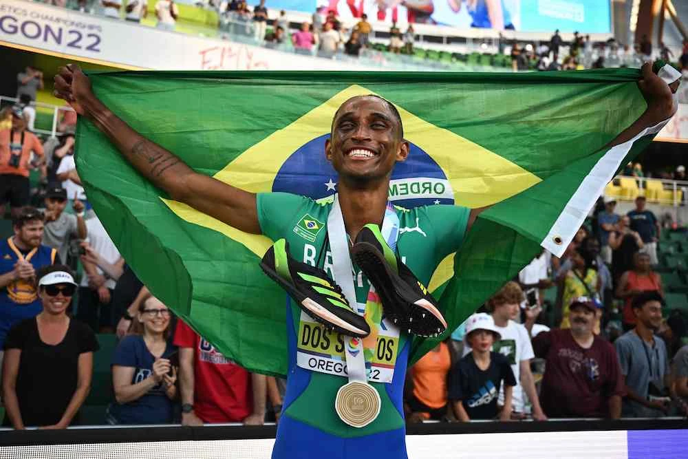 Brazil’s Alison Dos Santos celebrates after winning the men’s 400m hurdles final during the World Athletics Championships at Hayward Field in Eugene, Oregon on July 19, 2022. (AFP)