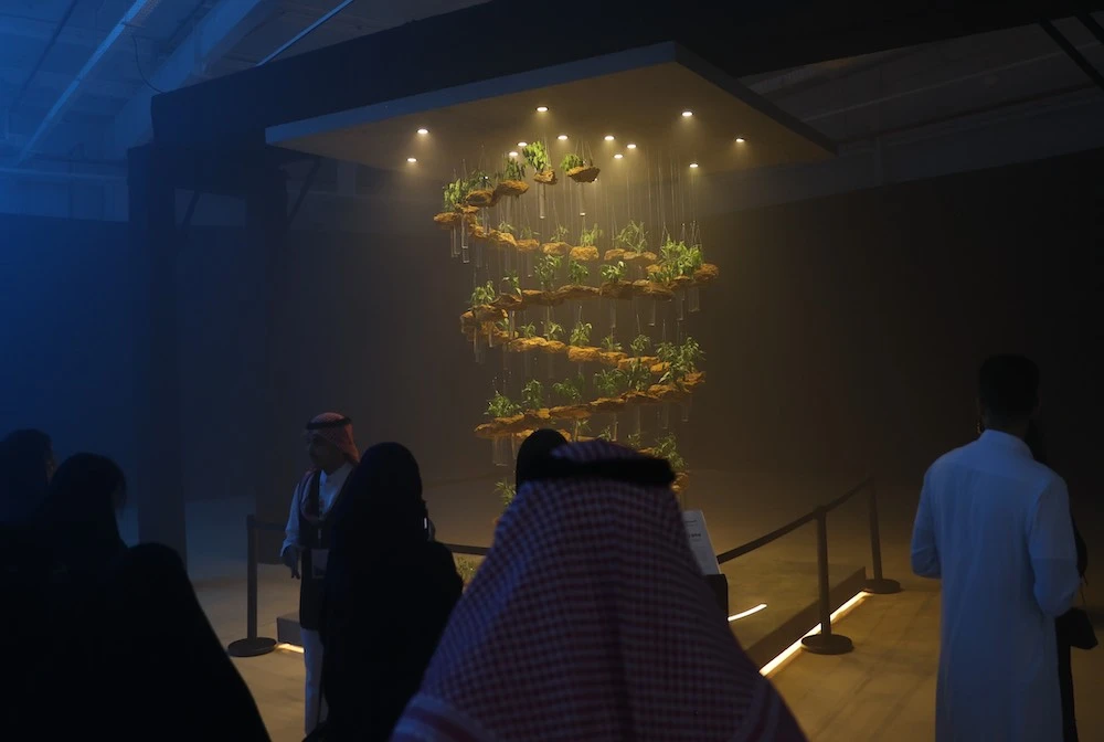 Emirati artist Alissar Mzayyek’s artwork, ‘Clear Vision - Beginning of the Journey,’ is a collection of suspended rocks taken from Jax and native Saudi plants, symbolizing the country’s upward-moving vision. (Saleh Ghannam/AN)