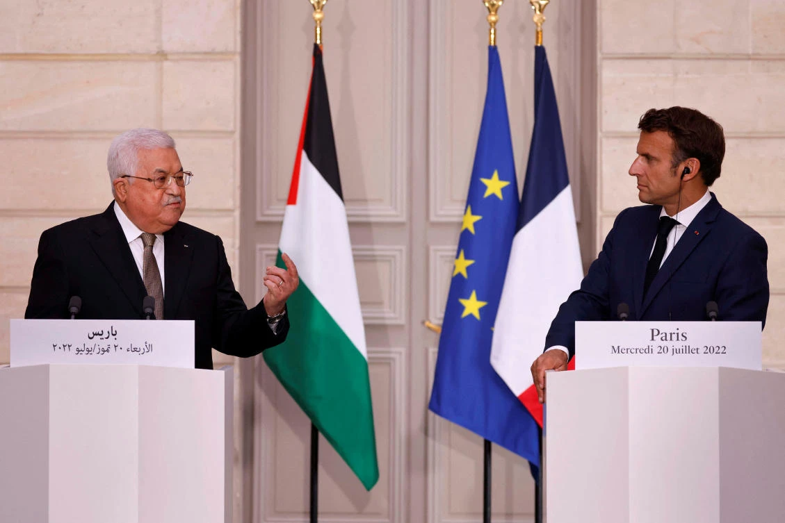 French President Emmanuel Macron listens as Palestinian President Mahmoud Abbas speaks during a joint news conference at the Elysee Presidential Palace in Paris, France, July 20, 2022. (Reuters)