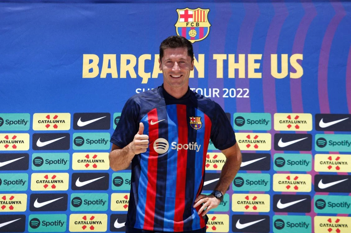 Polish football player Robert Lewandowski, gives a thumbs up during a press conference in Fort Lauderdale, Florida, on Wednesday as he is introduced as club Barcelona newest player. (AFP)