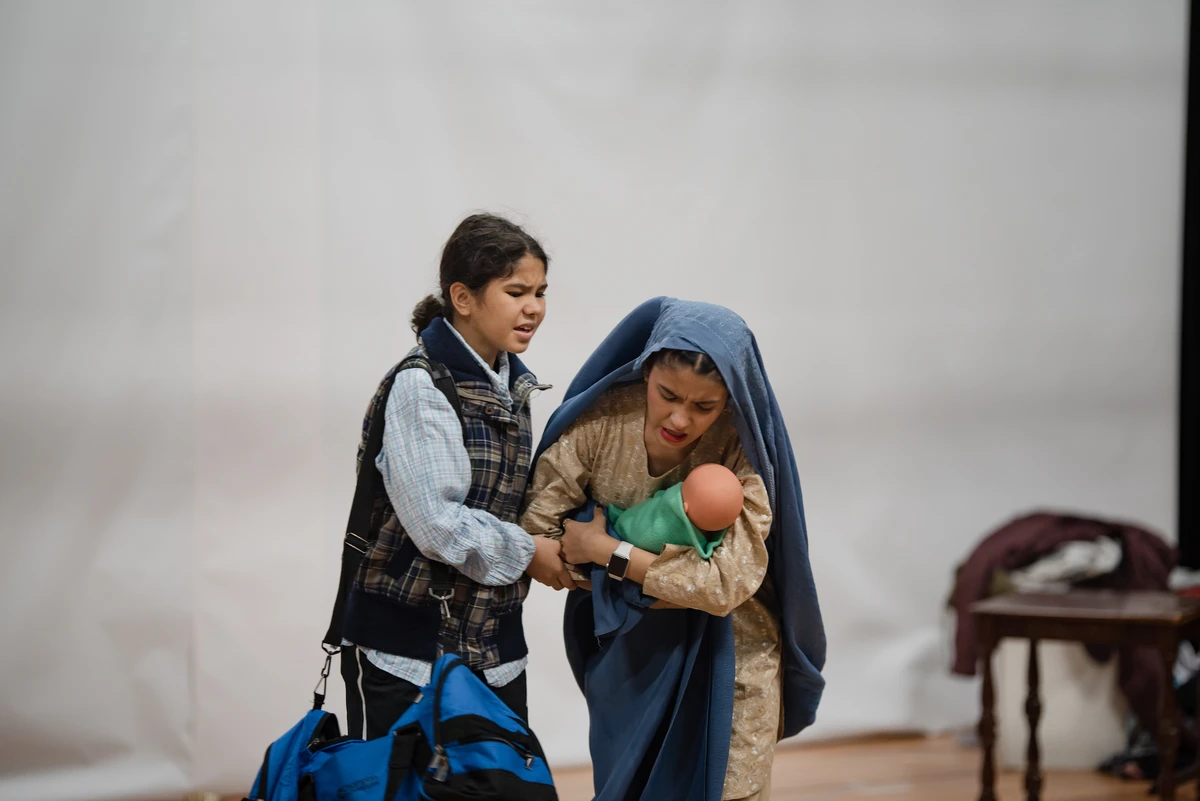Farzana Hussaini, right, rehearses her role in “And Then Came Spring.” (Amin Kamrani/Parastoo Theatre)
