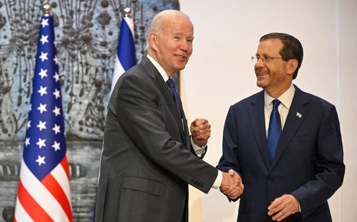 US President Joe Biden shakes hands with Israeli President Isaac Herzog at the Presidential residence in Jerusalem on July 14, 2022. (AFP)